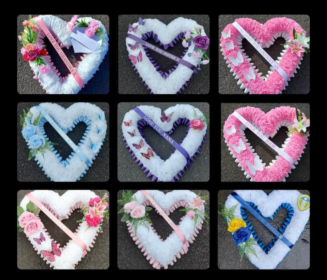 Open-heart tributes in colours and ribbon wording chosen by families